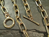 24" Gold Tone 6.5mm Paper Clip Chain - Toggle Clasp