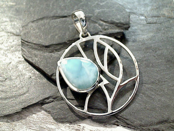 Larimar and sterling silver pendant measures around 2-1/8" tall with the bail by 1-1/2" wide at the max points and is slightly heavier weight. Use a thick gauge chain with this pendant. The color and pattern on the stone will vary slightly from the sample photos with each pendant.