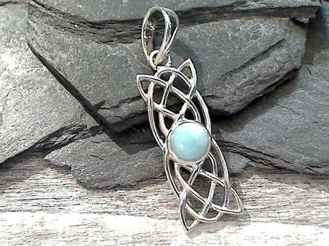 Larimar and sterling silver small pendant with Celtic knot work measures around around 1-1/2" tall with the bail by 3/8" wide at the max points and is light weight. Use a thin gauge chain with this pendant. The color and pattern on the stone will vary slightly from the sample photos with each pendant.