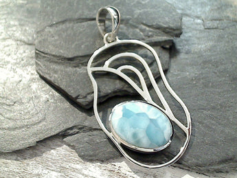 Larimar and sterling silver pendant measures around 2-3/8" tall with the bail by 1-1/8" wide at the max points and is slightly heavier weight. Use a thick gauge chain with this pendant. The color and pattern on the stone will vary slightly from the sample photos with each pendant.