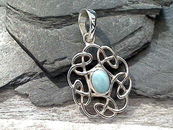Larimar and sterling silver small pendant with Celtic knot work measures around around 1-3/8" tall with the bail by 3/4" wide at the max points and is light weight. Use a thin gauge chain with this pendant. The color and pattern on the stone will vary slightly from the sample photos with each pendant.