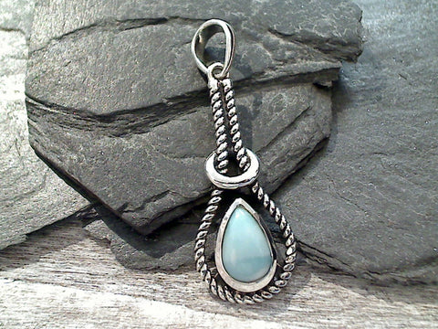 Larimar and sterling silver pendant measures around around 1-3/4" tall with the bail by 5/8" wide at the max points and is light weight. Use a thin gauge chain with this pendant. The color and pattern on the stone will vary slightly from the sample photos with each pendant.